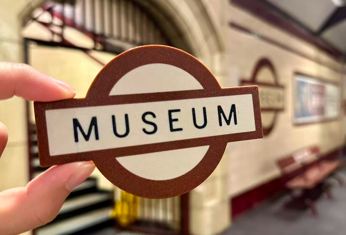 3D printed Museum Station fridge magnet inspired by Sydney’s iconic heritage train station signage, photographed inside Museum Station platform in Sydney CBD.