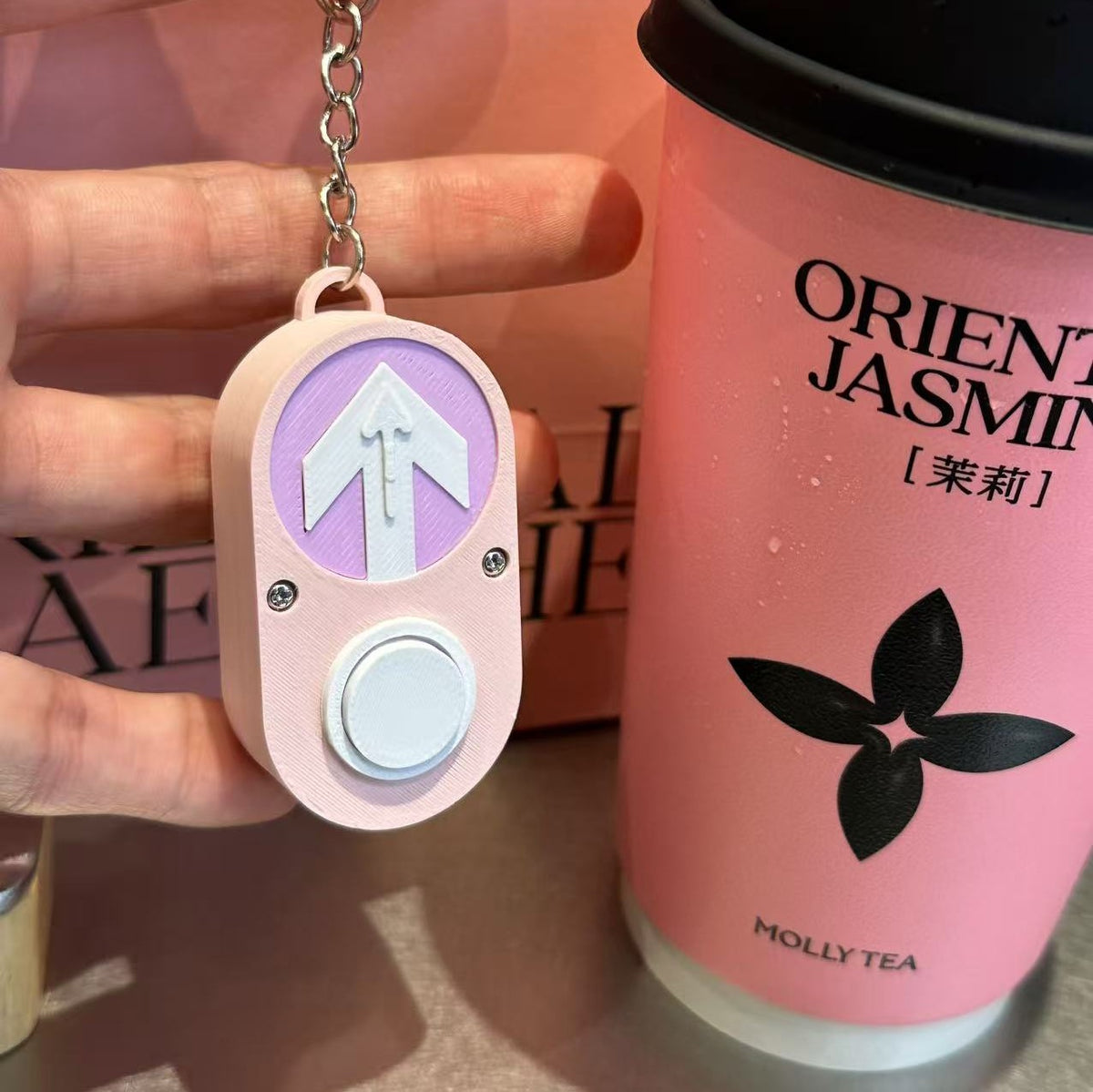 Cherry Blossom Australian pedestrian button keychain shown close up